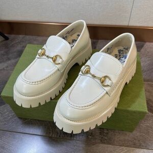 Gucci Cream Loafers with Gold Accents